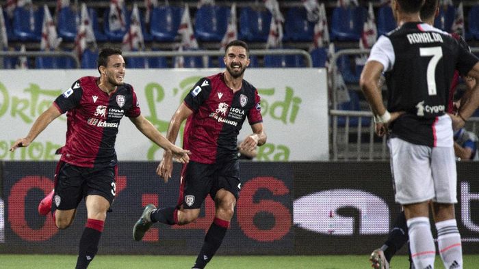 Cagliari, Juventus Cagliaris Luca Gagliano, left, celebrates after scoring during the Serie A soccer match between Cagliari and Juventus, at the Sardegna Arena stadium, in Cagliari, Italy, Wednesday, July 29, 2020. (Alessandro Tocco/Lapresse via AP)