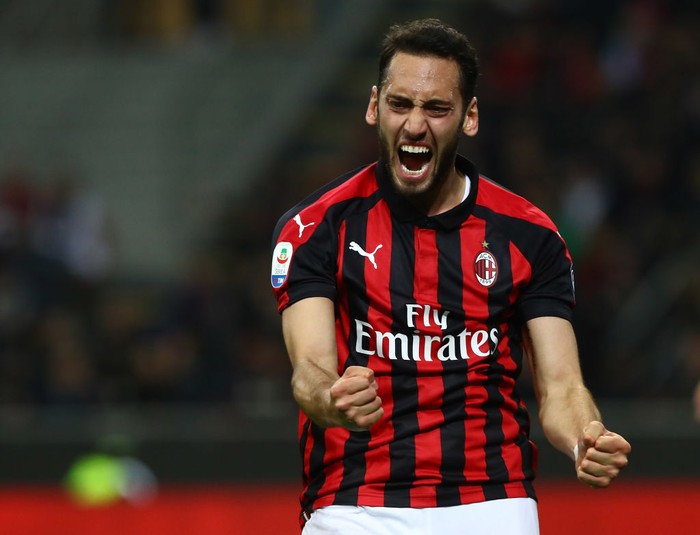 MILAN, ITALY - APRIL 13:  Hakan Calhanoglu of AC Milan reacts during the Serie A match between AC Milan and SS Lazio at Stadio Giuseppe Meazza on April 13, 2019 in Milan, Italy.  (Photo by Marco Luzzani/Getty Images)