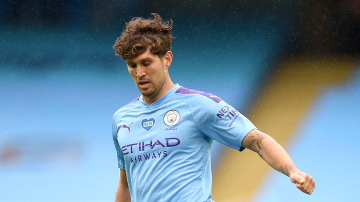 MANCHESTER, ENGLAND - JULY 08: John Stones of Manchester City in action during the Premier League match between Manchester City and Newcastle United at Etihad Stadium on July 08, 2020 in Manchester, England. Football Stadiums around Europe remain empty due to the Coronavirus Pandemic as Government social distancing laws prohibit fans inside venues resulting in all fixtures being played behind closed doors. (Photo by Oli Scarff/Pool viaGetty Images)