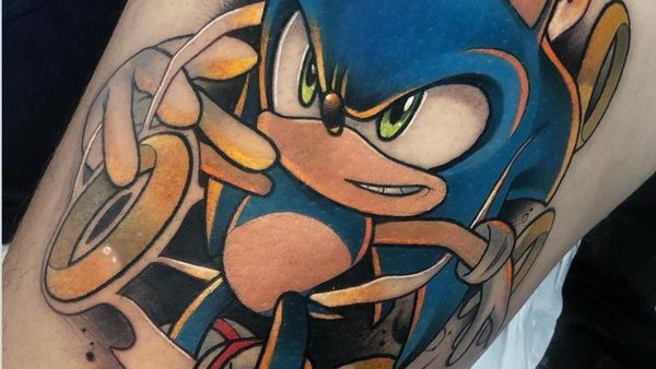 Keren! Seni Tato Gambar Kartun yang Berwarna