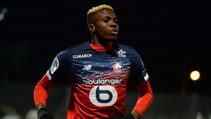 (FILES) This file photo taken on February 7, 2020 shows Lilles Nigerian forward Victor Osimhen celebrating scoring his teams first goal during the French L1 Football match between Angers SCO and Lille (LOSC), at Raymond-Kopa Stadium, in Angers, northwestern France. - Nigerian forward Victor Osimhen will join Naples (S.S.C. Napoli), the two football clubs announced on July 31, 2020. (Photo by JEAN-FRANCOIS MONIER / AFP)