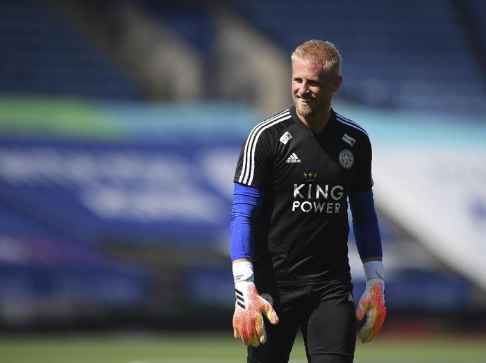 Leicesters goalkeeper Kasper Schmeichel smiles during warmup before the English Premier League soccer match between Leicester City and Manchester United at the King Power Stadium, in Leicester, England, Sunday, July 26, 2020. (Michael Regan/Pool via AP)