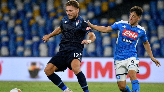 NAPLES, ITALY - AUGUST 01: Ciro Immobile of SS Lazio compete for the ball with Diego Demme of SSC Napoli during the Serie A match between SSC Napoli and  SS Lazio at Stadio San Paolo on August 01, 2020 in Naples, Italy. (Photo by Marco Rosi - SS Lazio/Getty Images)