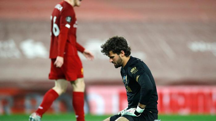 Alisson Becker LIVERPOOL, ENGLAND - JULY 22: Alisson Becker of Liverpool reacts following Chelseas second goal, scored by Tammy Abraham of Chelsea (not pictured) during the Premier League match between Liverpool FC and Chelsea FC at Anfield on July 22, 2020 in Liverpool, England. Football Stadiums around Europe remain empty due to the Coronavirus Pandemic as Government social distancing laws prohibit fans inside venues resulting in all fixtures being played behind closed doors. (Photo by Phil Noble/Pool via Getty Images)