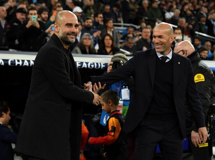 MADRID, SPAIN - FEBRUARY 26: Pep Guardiola, Manager of Manchester City shakes hands with Zinedine Zidane, Manager of Real Madrid prior to the UEFA Champions League round of 16 first leg match between Real Madrid and Manchester City at Bernabeu on February 26, 2020 in Madrid, Spain. (Photo by David Ramos/Getty Images)