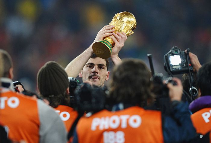 Iker Casillas JOHANNESBURG, SOUTH AFRICA - JULY 11: Iker Casillas of Spain lifts the World Cup trophy as the Spain team celebrate victory following the 2010 FIFA World Cup South Africa Final match between Netherlands and Spain at Soccer City Stadium on July 11, 2010 in Johannesburg, South Africa. (Photo by Laurence Griffiths/Getty Images)