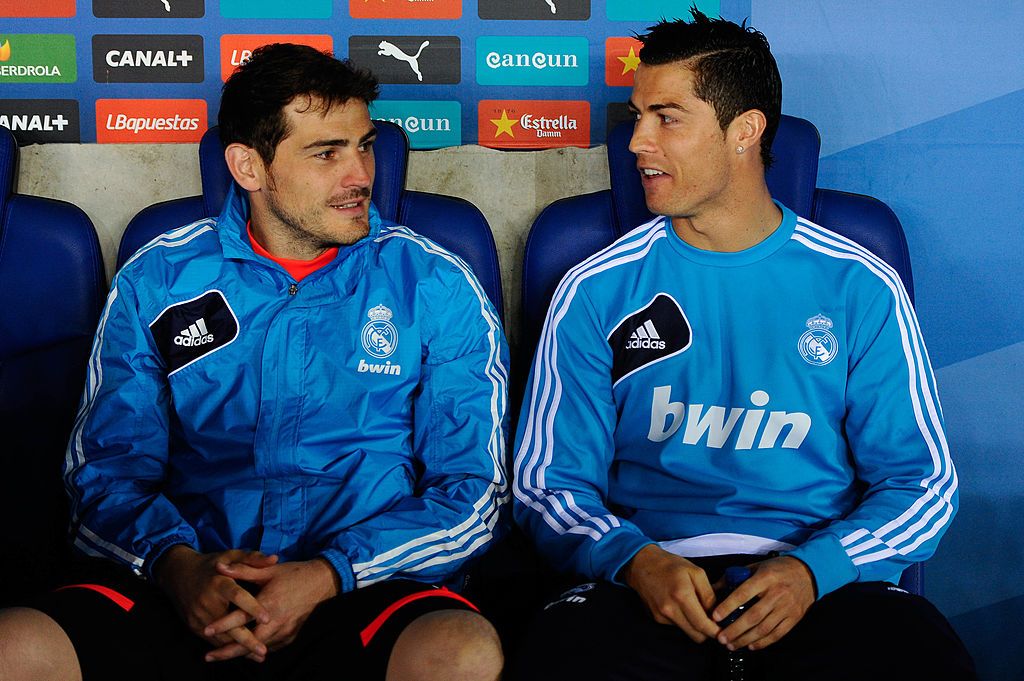 BARCELONA, SPAIN - MAY 11: Iker Casillas (L) and Cristiano Ronaldo of Real Madrid CF chat as they sit on the bench during the La Liga match between RCD Espanyol and Real Madrid CF at Cornella-El Prat Stadium on May 11, 2013 in Barcelona, Spain.  (Photo by David Ramos/Getty Images)