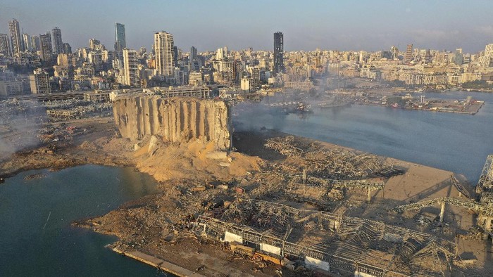 A drone picture shows smoke from the scene of an explosion at the seaport of Beirut, Lebanon, Wednesday, Aug. 5, 2020. A massive explosion rocked Beirut on Tuesday, flattening much of the citys port, damaging buildings across the capital and sending a giant mushroom cloud into the sky. (AP Photo/Hussein Malla)