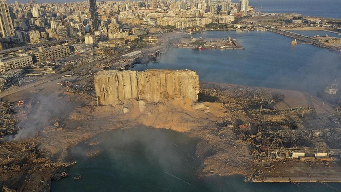 A drone picture shows smoke from the scene of an explosion at the seaport of Beirut, Lebanon, Wednesday, Aug. 5, 2020. A massive explosion rocked Beirut on Tuesday, flattening much of the citys port, damaging buildings across the capital and sending a giant mushroom cloud into the sky. (AP Photo/Hussein Malla)