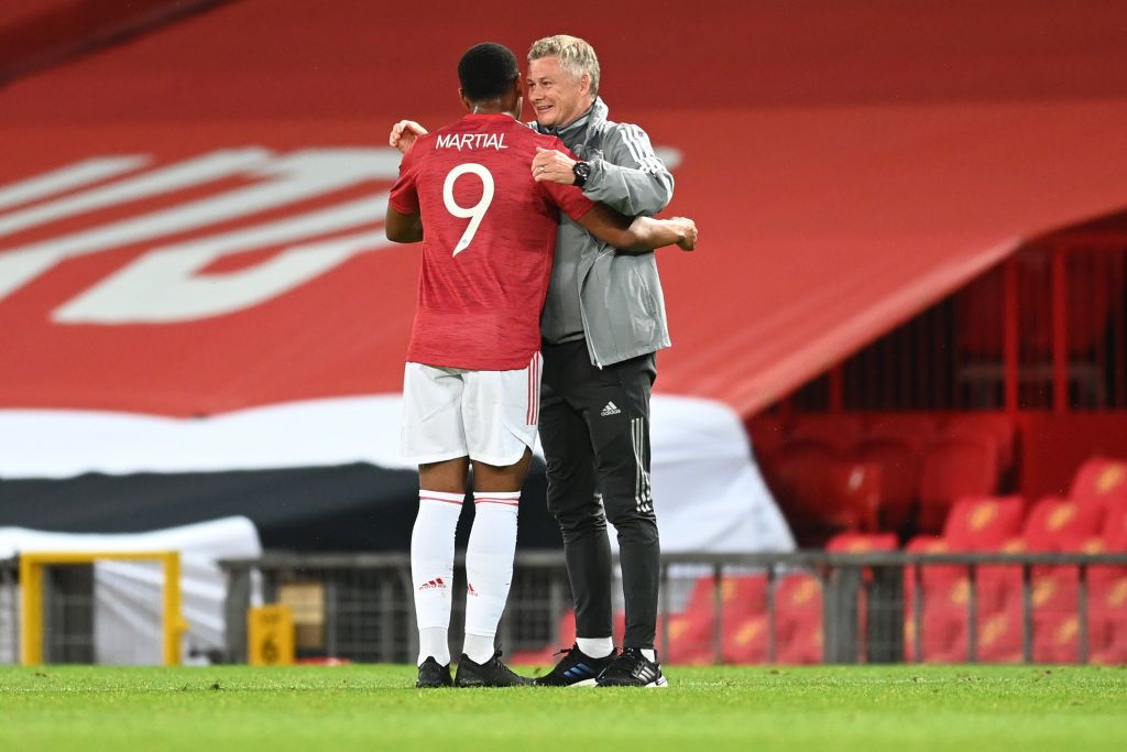 MANCHESTER, ENGLAND - AUGUST 05: Ole Gunnar Solskjaer, Manager of Manchester United embraces Anthony Martial during the UEFA Europa League round of 16 second leg match between Manchester United and LASK at Old Trafford on August 05, 2020 in Manchester, England. (Photo by Michael Regan/Getty Images)