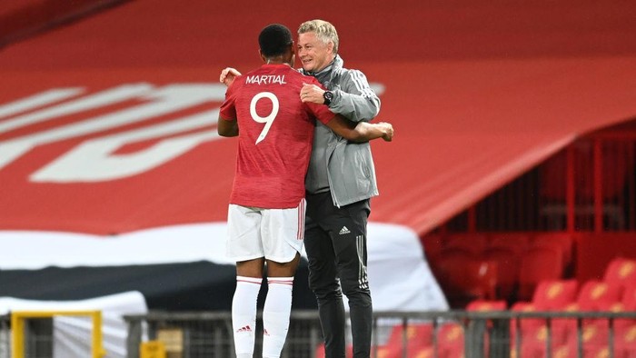 MANCHESTER, ENGLAND - AUGUST 05: Ole Gunnar Solskjaer, Manager of Manchester United embraces Anthony Martial during the UEFA Europa League round of 16 second leg match between Manchester United and LASK at Old Trafford on August 05, 2020 in Manchester, England. (Photo by Michael Regan/Getty Images)