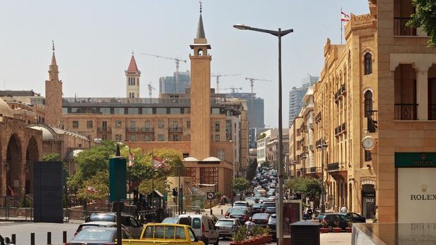 BEIRUT, LEBANON - AUGUST 14, 2014: Rush hour in Beirut downtown and view of the historical Al-Omari Grand Mosque at summer sunny day.