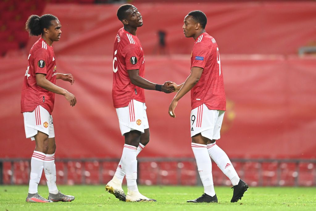 MANCHESTER, ENGLAND - AUGUST 05: Anthony Martial of Manchester United celebrates after scoring his sides second goal with Paul Pogba during the UEFA Europa League round of 16 second leg match between Manchester United and LASK at Old Trafford on August 05, 2020 in Manchester, England. (Photo by Michael Regan/Getty Images)