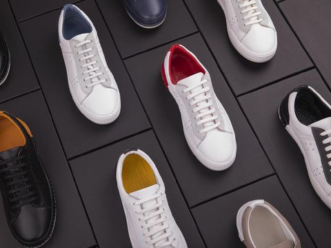 Close-up of sportswoman putting on sneakers.
