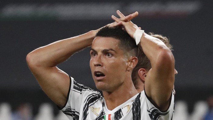Juventus Cristiano Ronaldo reacts during the Champions League round of 16 second leg, soccer match between Juventus and Lyon at the Allianz stadium in Turin, Italy, Friday, Aug. 7, 2020. (AP Photo/Antonio Calanni)