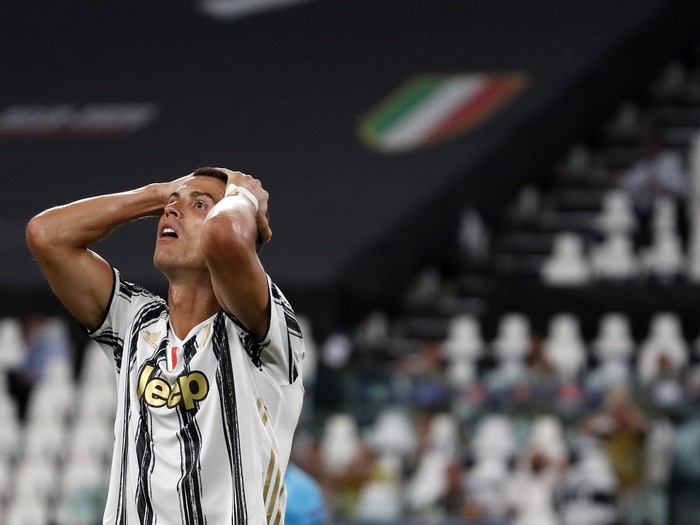Juventus Cristiano Ronaldo reacts during the Champions League round of 16 second leg, soccer match between Juventus and Lyon at the Allianz stadium in Turin, Italy, Friday, Aug. 7, 2020. (AP Photo/Antonio Calanni)