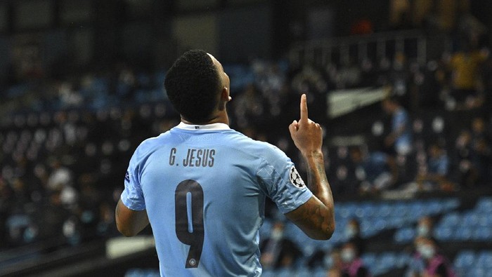 Manchester Citys Gabriel Jesus celebrates after scoring his sides second goal during the Champions League, round of 16, second leg soccer match between Manchester City and Real Madrid at the Etihad Stadium in Manchester, England, Friday, Aug. 7, 2020. (Oli Scarff/Pool Photo via AP)