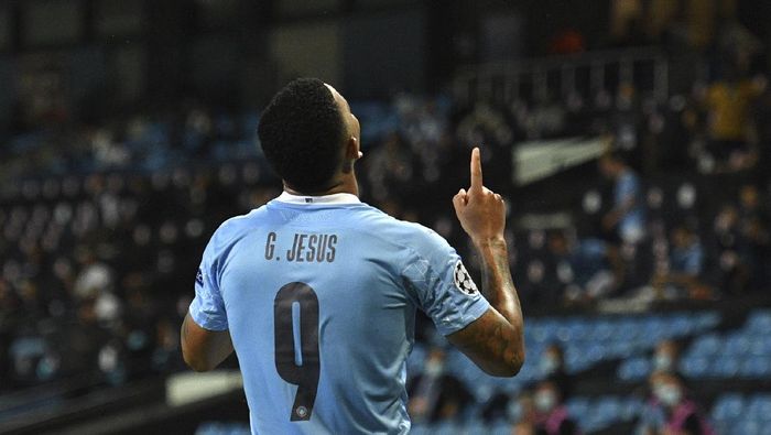 gabriel jesus manchester city manchester city vs real madrid liga champions babak 16 besar liga champions Manchester Citys Gabriel Jesus celebrates after scoring his sides second goal during the Champions League, round of 16, second leg soccer match between Manchester City and Real Madrid at the Etihad Stadium in Manchester, England, Friday, Aug. 7, 2020. (Oli Scarff/Pool Photo via AP)