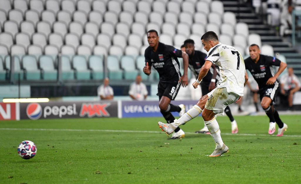 TURIN, ITALY - AUGUST 07: Cristiano Ronaldo of Juventus scores a penalty for his team's first goal during the UEFA Champions League round of 16 second leg match between Juventus and Olympique Lyon at Allianz Stadium on August 07, 2020 in Turin, Italy. (Photo by Valerio Pennicino/Getty Images)