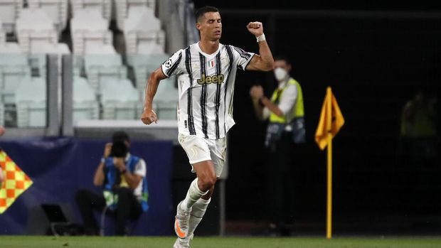 Juventus' Cristiano Ronaldo reacts after scoring a penalty during the Champions League round of 16 second leg, soccer match between Juventus and Lyon at the Allianz stadium in Turin, Italy, Friday, Aug. 7, 2020. (AP Photo/Antonio Calanni)