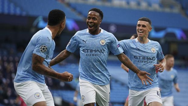 Manchester City's Raheem Sterling, center, celebrates after scoring the opening goal during the Champions League round of 16, second leg soccer match between Manchester City and Real Madrid at the Etihad Stadium in Manchester, England, Friday, Aug. 7, 2020. (AP Photo/Dave Thompson, Pool)