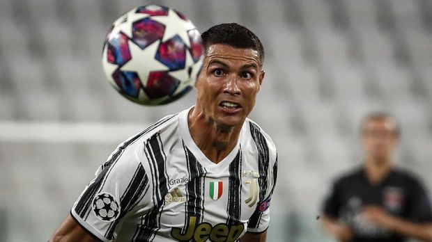 Juventus' Cristiano Ronaldo goes for the ball during the Champions League round of 16 second leg, soccer match between Juventus and Lyon at the Allianz stadium in Turin, Italy, Friday, Aug. 7, 2020. (AP Photo/Antonio Calanni)