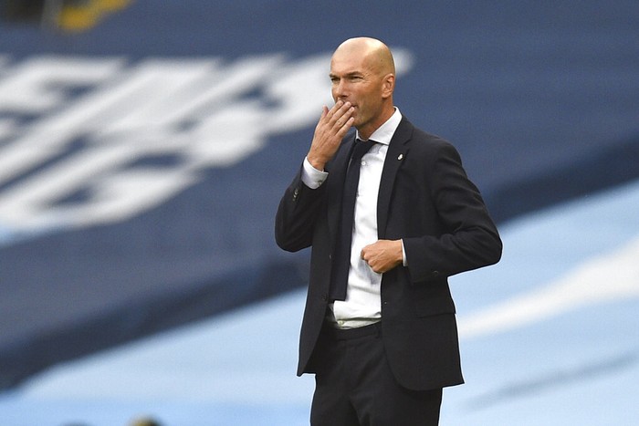 Real Madrids head coach Zinedine Zidane gestures during the Champions League, round of 16, second leg soccer match between Manchester City and Real Madrid at the Etihad Stadium stadium in Manchester, England, Friday, Aug. 7, 2020. (Oli Scarff/Pool Photo via AP)