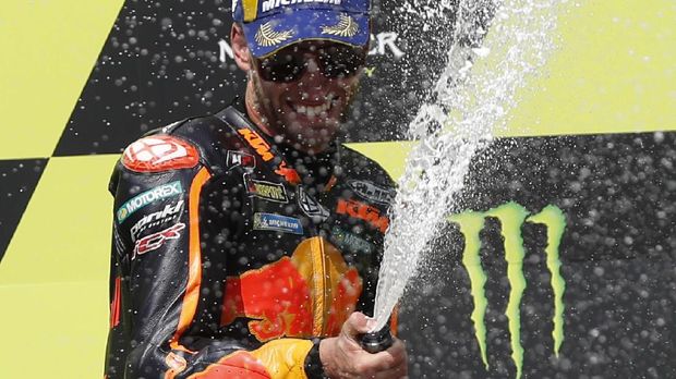 South African rider Brad Binder celebrates wining the MotoGP at the Czech Republic motorcycle Grand Prix at the Automotodrom Brno, in Brno, Czech Republic, Sunday, Aug. 9, 2020. (AP Photo/Petr David Josek)