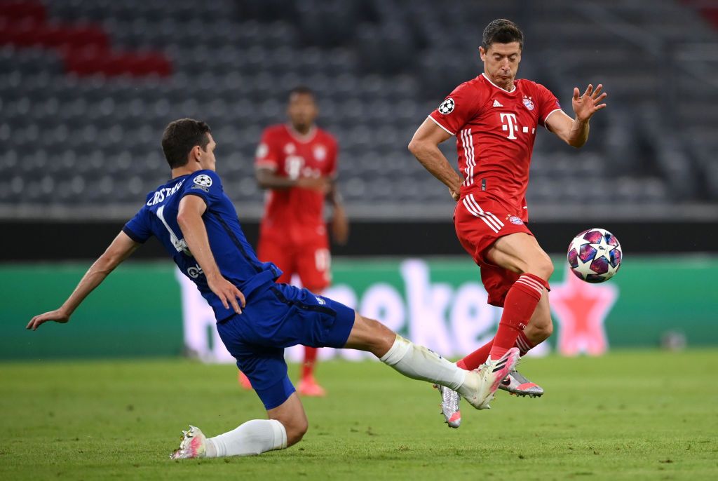 MUNICH, GERMANY - AUGUST 08: Andreas Christensen of Chelsea  battles for possession with  Robert Lewandowski of Bayern Munich during the UEFA Champions League round of 16 second leg match between FC Bayern Muenchen and Chelsea FC at Allianz Arena on August 08, 2020 in Munich, Germany. (Photo by Matthias Hangst/Getty Images)