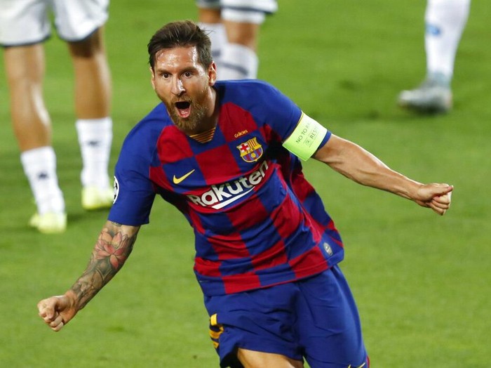 Barcelonas Lionel Messi celebrates after scoring his sides second goal during the Champions League round of 16, second leg soccer match between Barcelona and Napoli at the Camp Nou Stadium in Barcelona, Spain, Saturday, Aug. 8, 2020. (AP Photo/Joan Monfort)