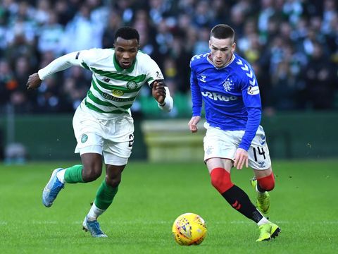 GLASGOW, SCOTLAND - DECEMBER 29: Boli Bolingoli of Celtic  and Ryan Kent of Rangers battle for possession during the Ladbrokes Premiership match between Celtic and Rangers at Celtic Park on December 29, 2019 in Glasgow, Scotland. (Photo by Mark Runnacles/Getty Images)