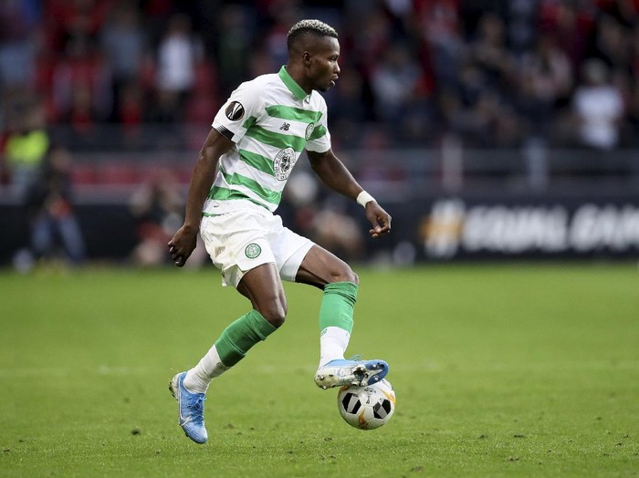FILE - In this Thursday, Sept. 19, 2019 file photo, Celtics Boli Bolingoli-Mbombo controls the ball during the Europa League Group E soccer match between Rennes and Celtic, at the Roazhon Park stadium in Rennes, France. Scottish soccer is in danger of being halted by the country’s government after a Celtic player breached coronavirus rules by taking a secret trip to Spain and failing to self-isolate on his return. The Scottish champions have begun a “full investigation” into the actions of left back Boli Bolingoli, it was reported on Tuesday, Aug. 11, 2020. (AP Photo/David Vincent, File)