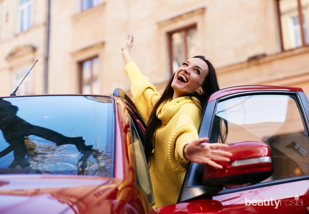 girl-rejoices-life-sits-her-red-car