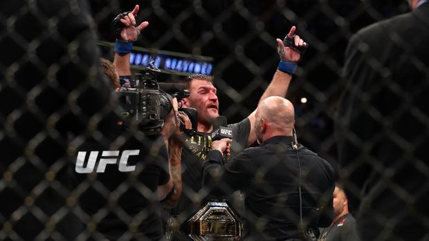 ANAHEIM, CALIFORNIA - AUGUST 17: Stipe Miocic celebrates his win over Daniel Cormier after their UFC Heavyweight Title Bout at UFC 241 at Honda Center on August 17, 2019 in Anaheim, California.   Joe Scarnici/Getty Images/AFP