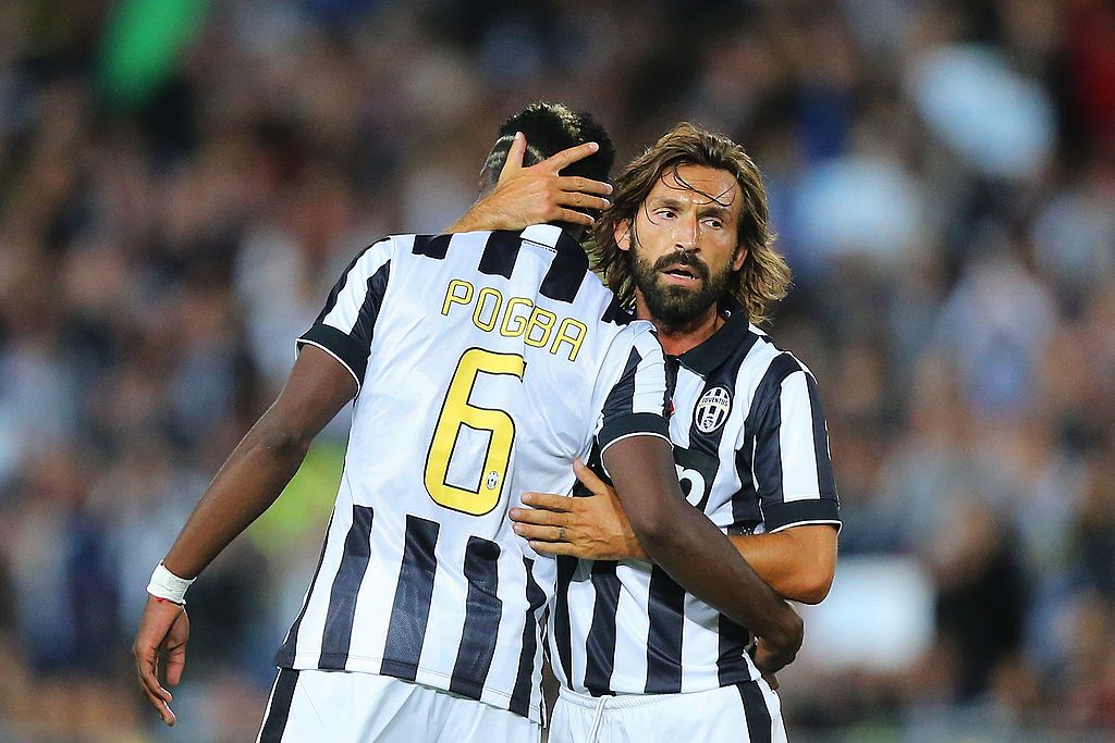 SYDNEY, AUSTRALIA - AUGUST 10: Paul Pogba (L) of Juventus celebrates his goal with Andrea Pirlo of Juventus during the match between the A-League All Stars and Juventus at ANZ Stadium on August 10, 2014 in Sydney, Australia.  (Photo by Joosep Martinson/Getty Images)