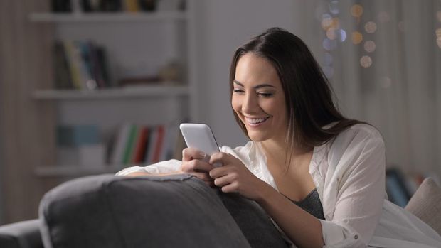 Close-up portrait of her she nice attractive lovely cute charming lovable sweet shine cheerful cheery wavy-haired girl browsing chatting at industrial loft wooden brick style interior room.