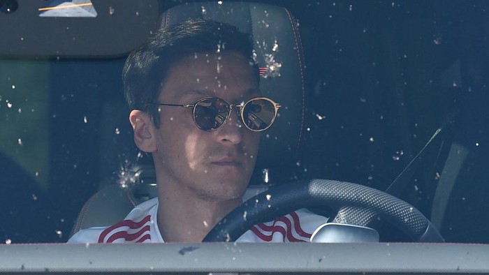 Arsenals German midfielder Mesut Ozil arrives at Arsenals Colney training centre north of London on May 20, 2020 as training continues for Premier League clubs with a June re-start the intention during the COVID-19 pandemic. - Teams have started socially-distanced training in small groups this week, but several Premier League stars have expressed concerns about plans to resume the season. (Photo by Glyn KIRK / AFP)