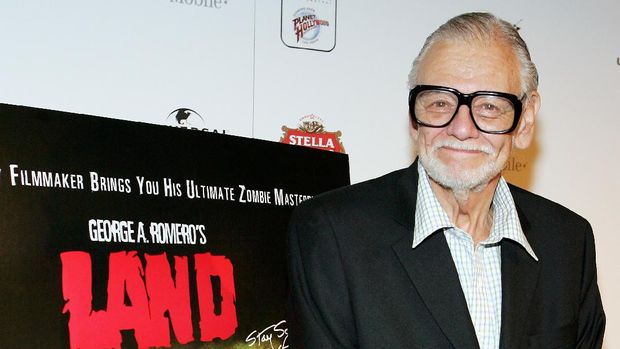 LAS VEGAS - JUNE 18: (US TABS AND HOLLYWOOD REPORTER OUT) Director George A. Romero poses next to a poster for his movie 