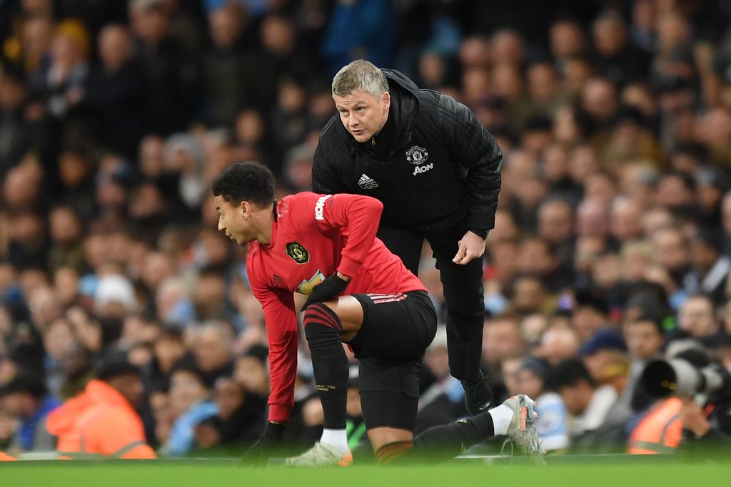 MANCHESTER, ENGLAND - DECEMBER 07: Ole Gunnar Solskjaer, Manager of Manchester United gives instructions to Jesse Lingard of Manchester United during the Premier League match between Manchester City and Manchester United at Etihad Stadium on December 07, 2019 in Manchester, United Kingdom. (Photo by Michael Regan/Getty Images)