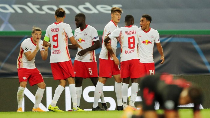 LISBON, PORTUGAL - AUGUST 13: Tyler Adams of RB Leipzig celebrates with teammates after scoring his teams second goal during the UEFA Champions League Quarter Final match between RB Leipzig and Club Atletico de Madrid at Estadio Jose Alvalade on August 13, 2020 in Lisbon, Portugal. (Photo by Miguel A. Lopes/Pool via Getty Images)