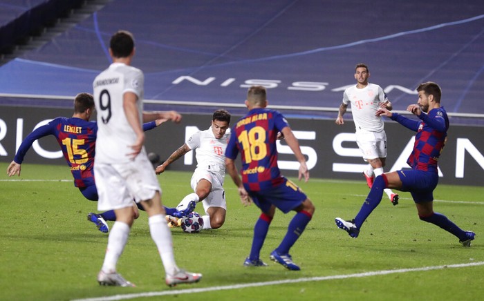 Bayern's Philippe Coutinho, center, scores his sides seventh goal during the Champions League quarterfinal match between FC Barcelona and Bayern Munich at the Luz stadium in Lisbon, Portugal, Friday, Aug. 14, 2020. (AP Photo/Manu Fernandez/Pool)