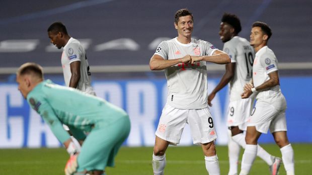 Bayern's Robert Lewandowski celebrates after scoring his sides sixth goal during the Champions League quarterfinal match between FC Barcelona and Bayern Munich at the Luz stadium in Lisbon, Portugal, Friday, Aug. 14, 2020. (AP Photo/Manu Fernandez/Pool)