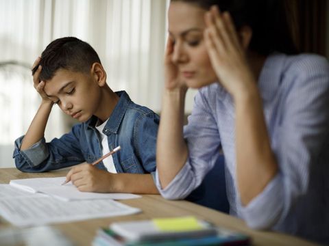 Teenage boy having problems in finishing homework