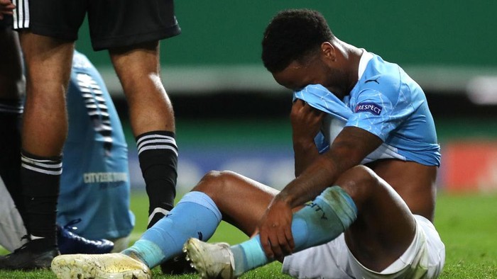 LISBON, PORTUGAL - AUGUST 15: Raheem Sterling of Manchester City looks dejected following his teams defeat in the UEFA Champions League Quarter Final match between Manchester City and Lyon at Estadio Jose Alvalade on August 15, 2020 in Lisbon, Portugal. (Photo by Miguel A. Lopes/Pool via Getty Images)