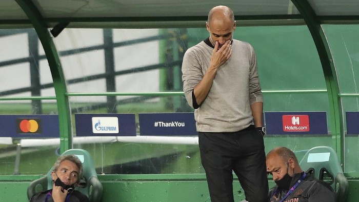 Manchester Citys head coach Pep Guardiola reacts during the Champions League quarterfinal soccer match between Lyon and Manchester City at the Jose Alvalade stadium in Lisbon, Portugal, Saturday, Aug. 15, 2020. (Miguel A. Lopes/Pool via AP)