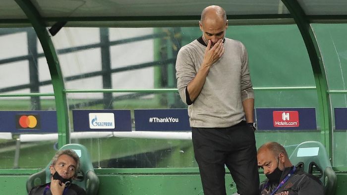 pep guardiola manchester city liga champions perempatfinal liga champions manchester city vs lyon Manchester Citys head coach Pep Guardiola reacts during the Champions League quarterfinal soccer match between Lyon and Manchester City at the Jose Alvalade stadium in Lisbon, Portugal, Saturday, Aug. 15, 2020. (Miguel A. Lopes/Pool via AP)