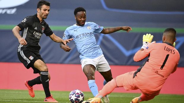 Manchester City's Raheem Sterling, centre, attempts to kick the ball past Lyon's goalkeeper Anthony Lopes during the Champions League quarterfinal match between Manchester City and Lyon at the Jose Alvalade stadium in Lisbon, Portugal, Saturday, Aug. 15, 2020. (Franck Fife/Pool Photo via AP)