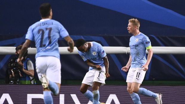 Manchester City's Kevin De Bruyne, right, celebrates after scoring his team's first goal during the Champions League quarterfinal match between Manchester City and Lyon at the Jose Alvalade stadium in Lisbon, Portugal, Saturday, Aug. 15, 2020. (Franck Fife/Pool Photo via AP)