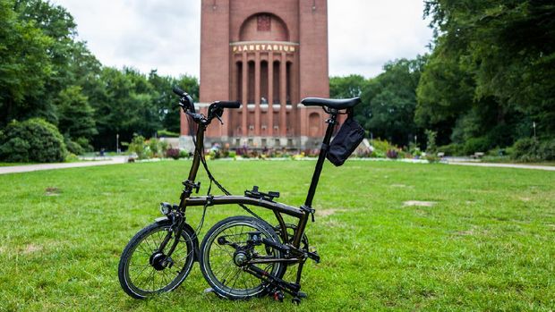 Hamburg, Germany - July 14, 2018: The Brompton black lacquer edition bike in front of the Planetarium