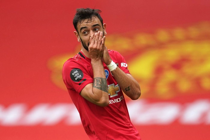 MANCHESTER, ENGLAND - JULY 04: Bruno Fernandes of Manchester United reacts after a missed chance during the Premier League match between Manchester United and AFC Bournemouth  at Old Trafford on July 04, 2020 in Manchester, England. Football Stadiums around Europe remain empty due to the Coronavirus Pandemic as Government social distancing laws prohibit fans inside venues resulting in all fixtures being played behind closed doors. (Photo by Dave Thompson/Pool via Getty Images)